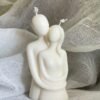 Couple embrace candle