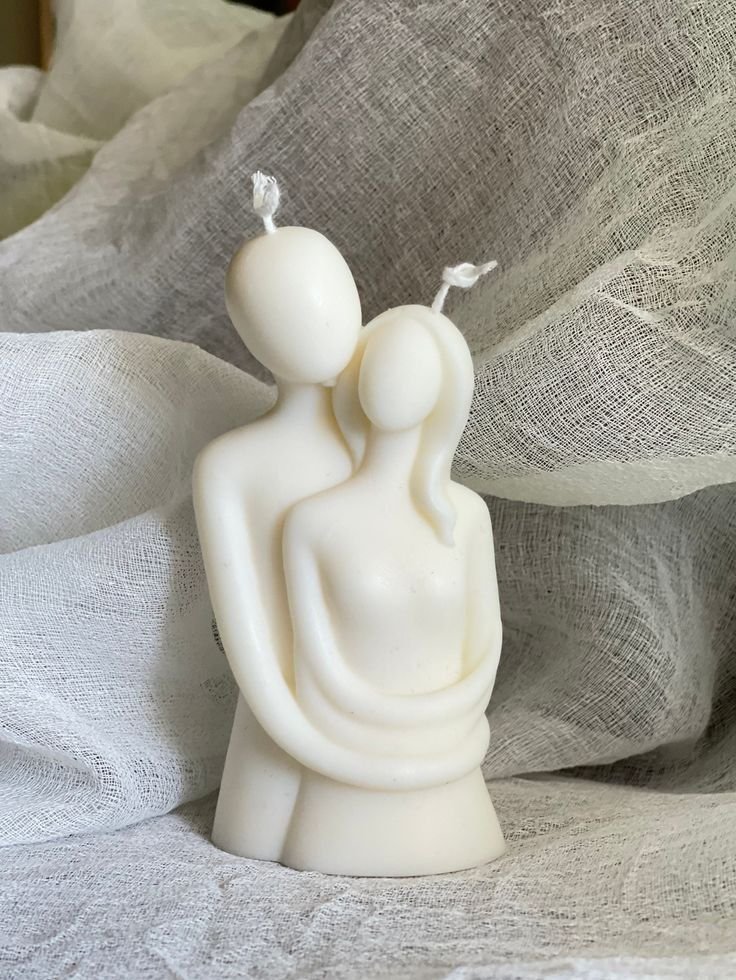 Couple embrace candle