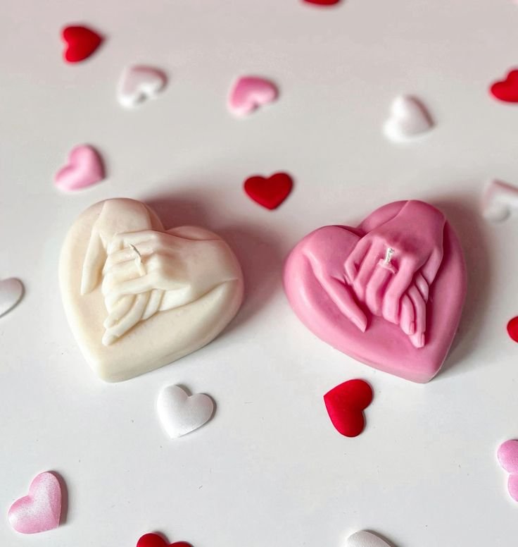 Heart shape holding hands candle